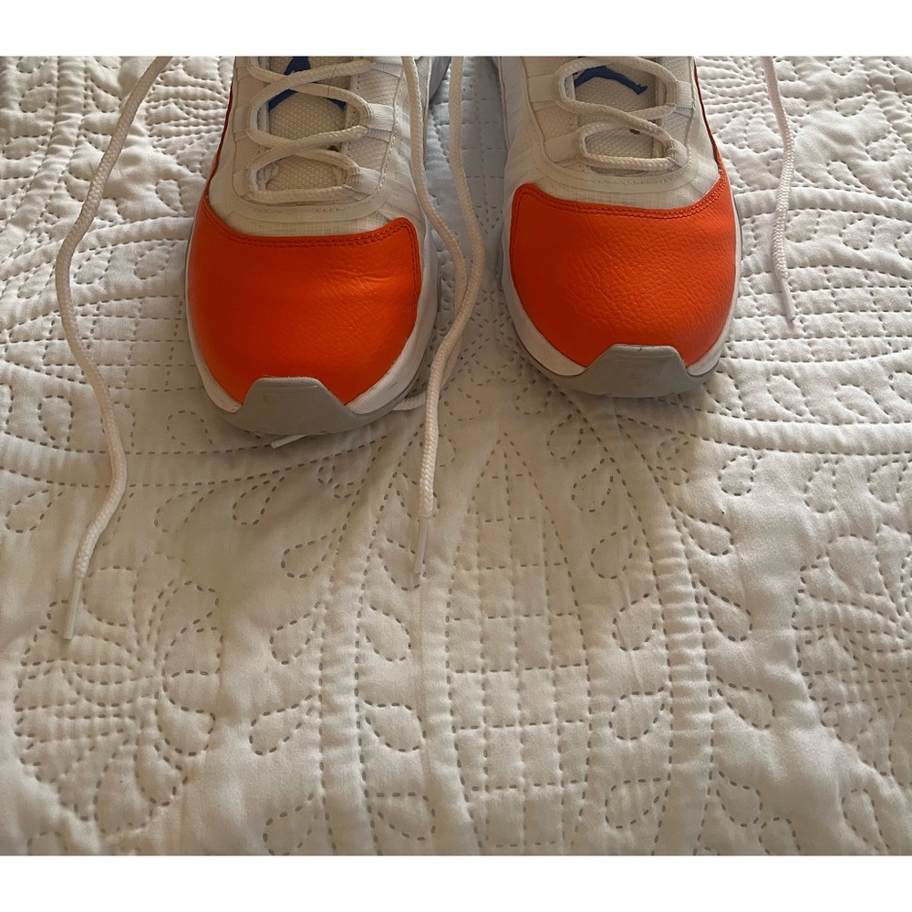 Orange and blue Nike sneakers. Worn 4 times.